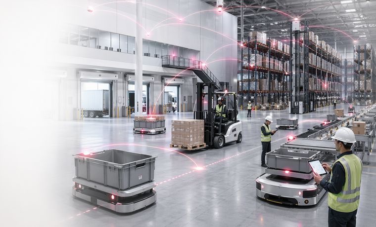 Forklifts, AMRs and handheld scanners operating in a high-bay warehouse